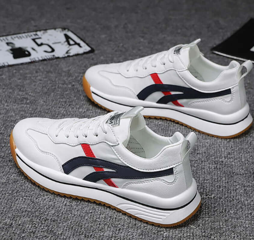 Tennis sneakers for men featuring a stylish design in white with red and navy accents for sporty and casual looks.