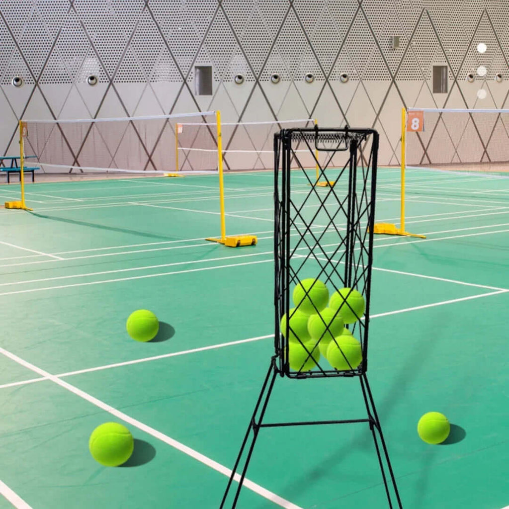 Best tennis ball collector with tennis balls in a sports hall setting, showcasing an organized collection solution.
