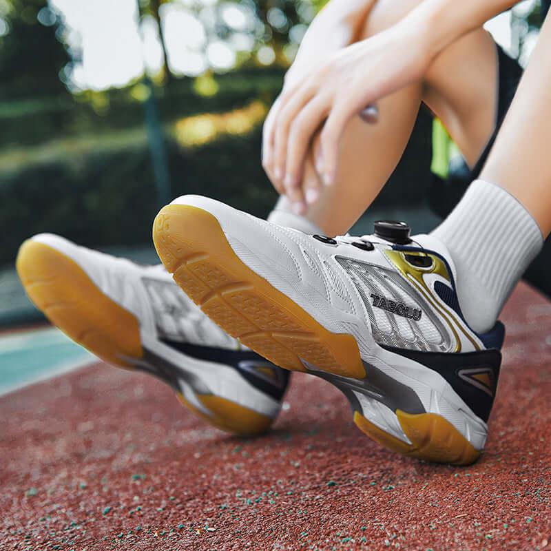 Breathable tennis shoes featuring a stylish design and comfortable fit on a clay court.