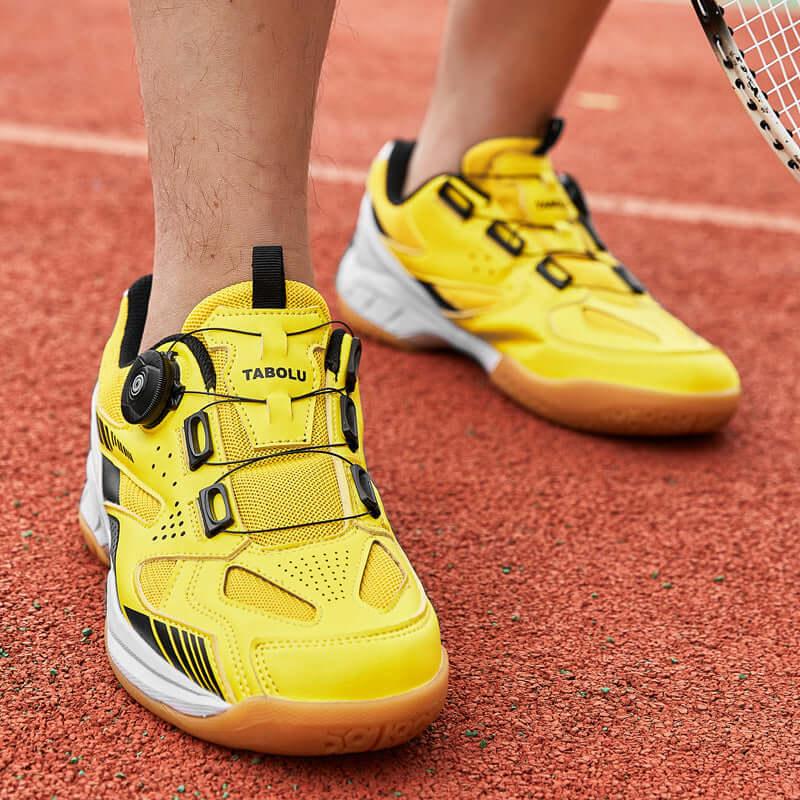 Breathable tennis shoes in bright yellow with unique design, ideal for performance on the court.
