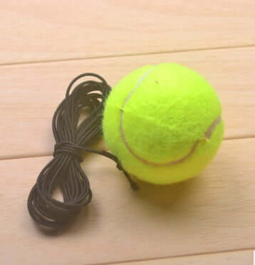 Tennis with Tennis String - compact tennis training string rebound aid for indoor outdoor practice.