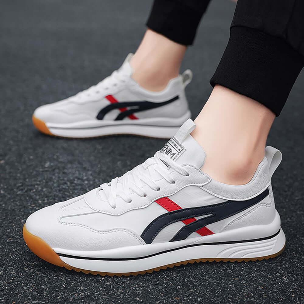 Tennis sneakers for men in white with red and navy accents, perfect for on-court performance and casual wear.