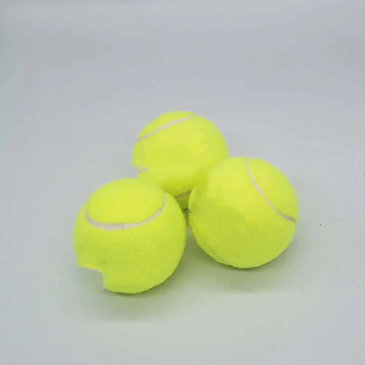 High quality wool tennis balls - three bright yellow tennis balls on a gray background.