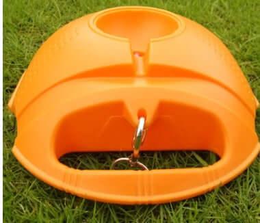 Senior tennis training equipment durable practice tool with handle and ball holder on grass.