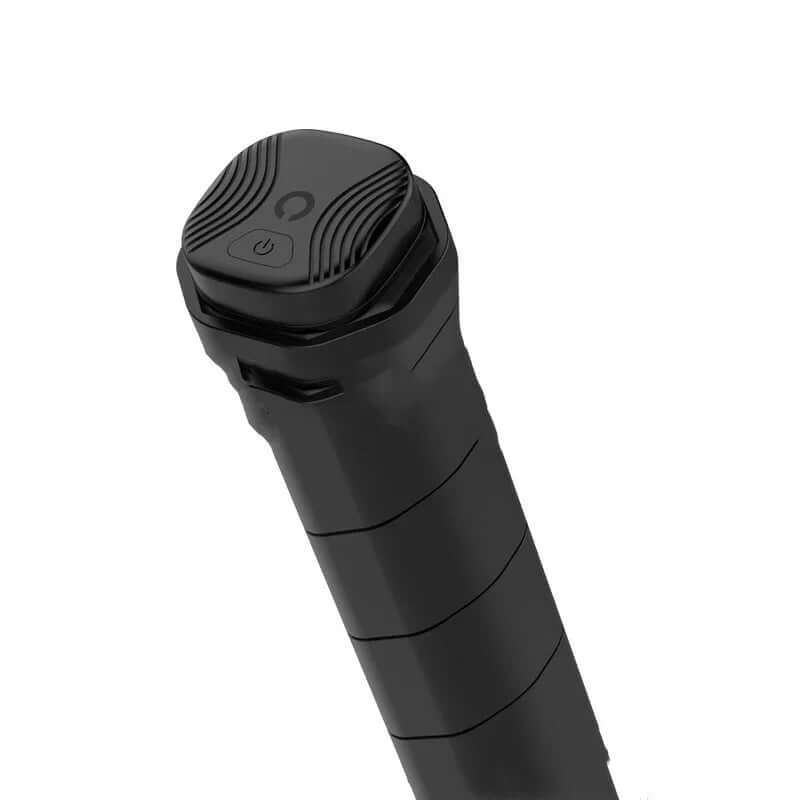 Smart tennis ball sensor's top view showcasing the power button and textured grip design for optimal use in ball games.