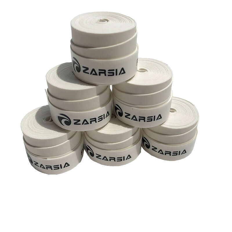 Special sweat absorbing belt for tennis racket rolls stacked neatly with Zarsia branding.