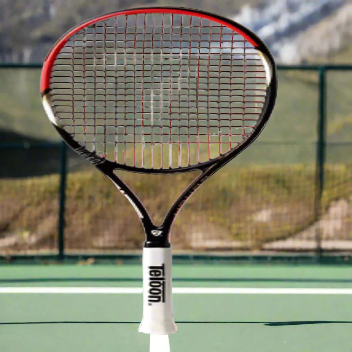 Teloon Tennis Racket on a tennis court showcasing its lightweight design and precision for players.