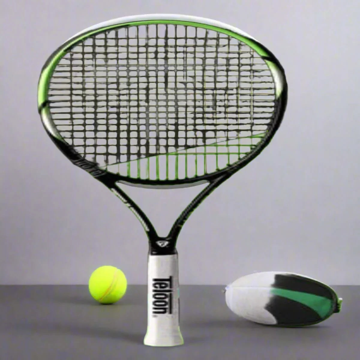 Teloon Tennis Racket placed next to a tennis ball and a tennis ball can on a gray background.