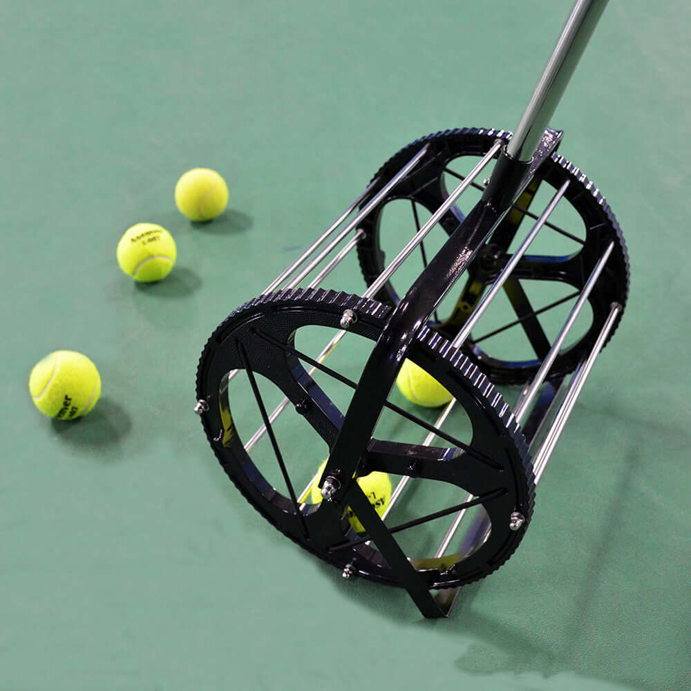 Tennis Ball Picker Pick Up Basket Tennis Trainer Recycler collecting tennis balls on a court surface.