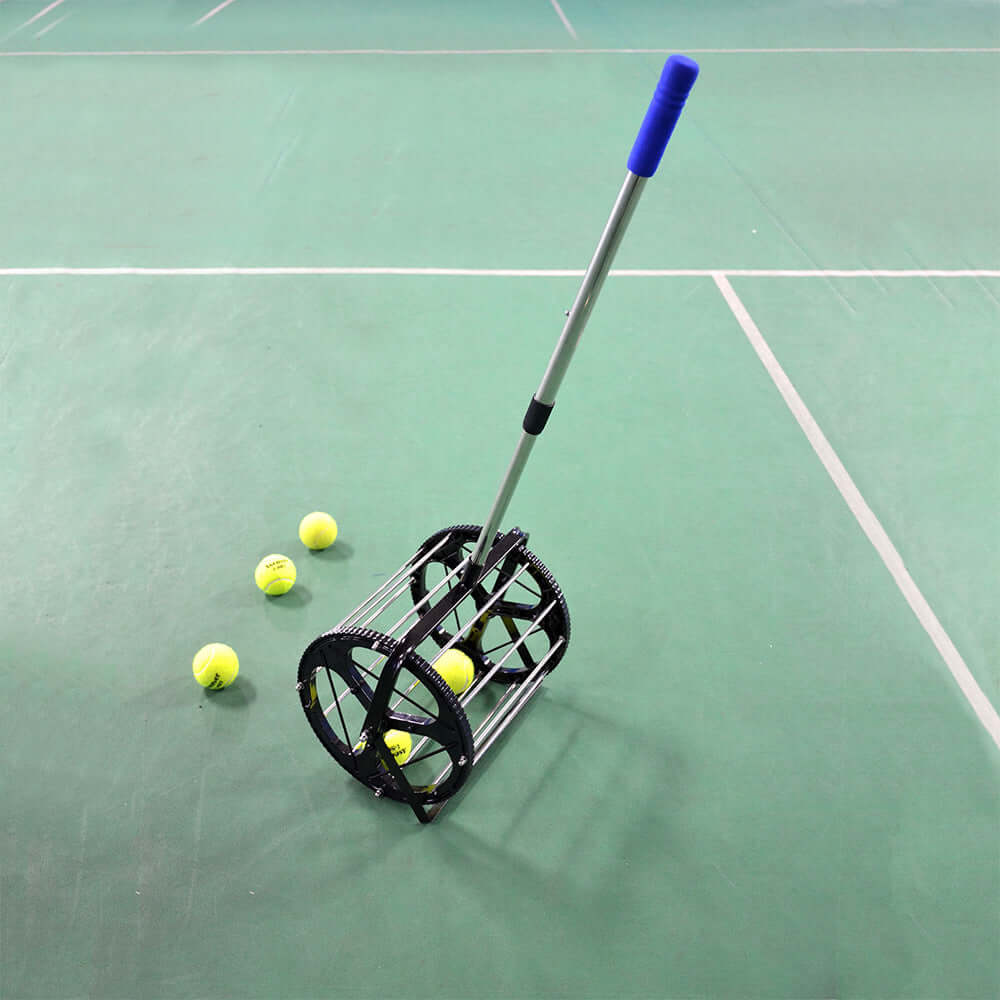 Tennis Ball Picker Pick Up Basket Tennis Trainer Recycler on the court with tennis balls scattered around.