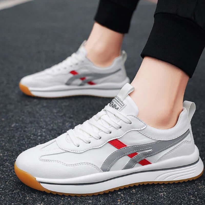 Tennis sneakers for men in white and red, designed for comfort and durability during sports and casual wear.