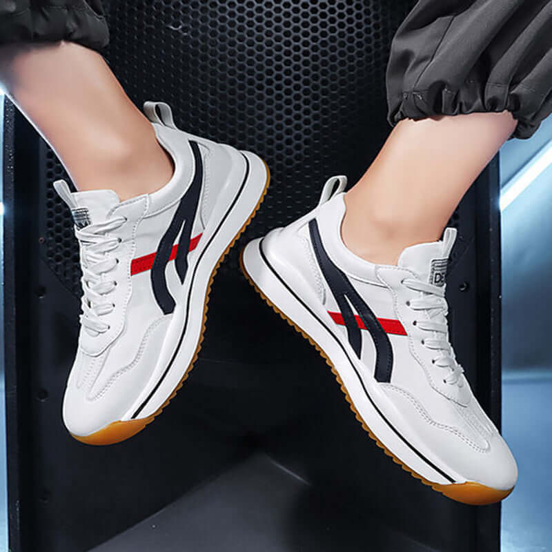 Tennis sneakers for men in white leather with red and black stripes, perfect for sports and casual wear.
