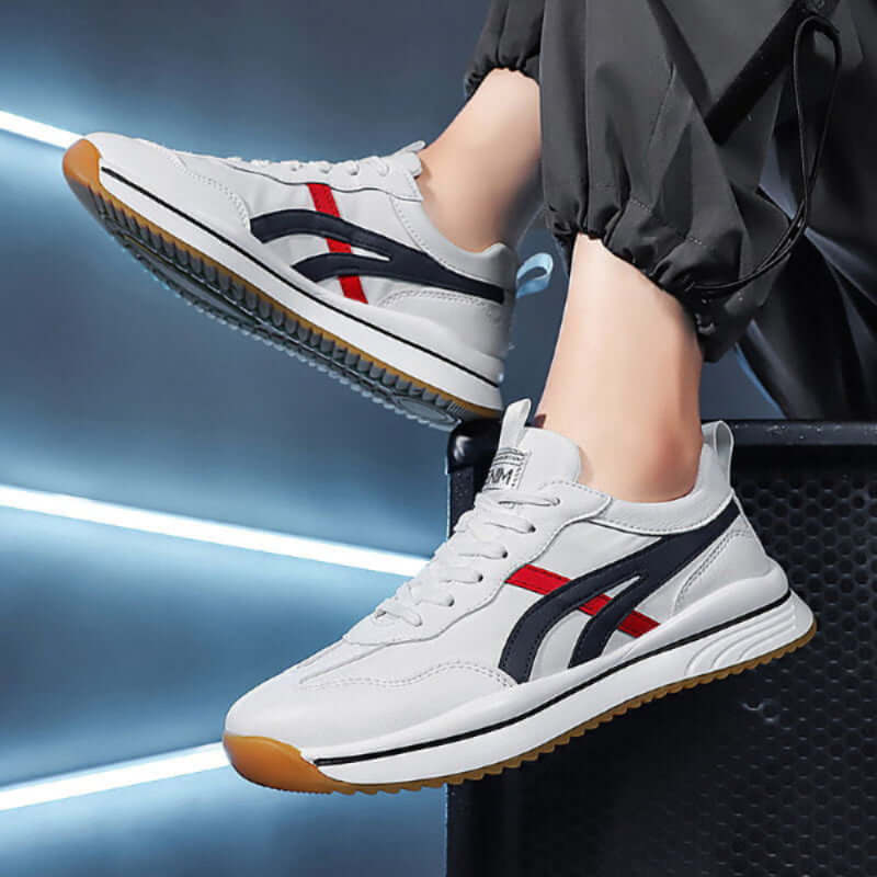 Tennis sneakers for men designed for comfort and durability, featuring a sleek white and navy design.