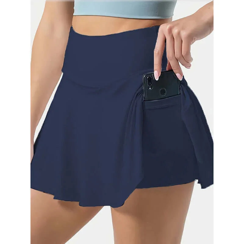 Women’s tennis skirt in navy blue with high waist and pockets, perfect for activewear.