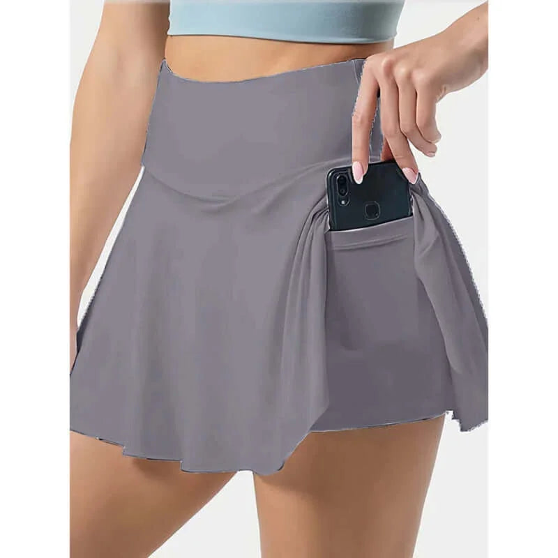Women's tennis skirt featuring a high waist and pockets, perfect for active wear and leisure.