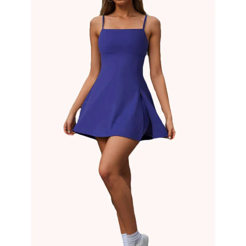 Women's tennis dress with shorts in purple, featuring a chic side slit and spaghetti straps for style and comfort.